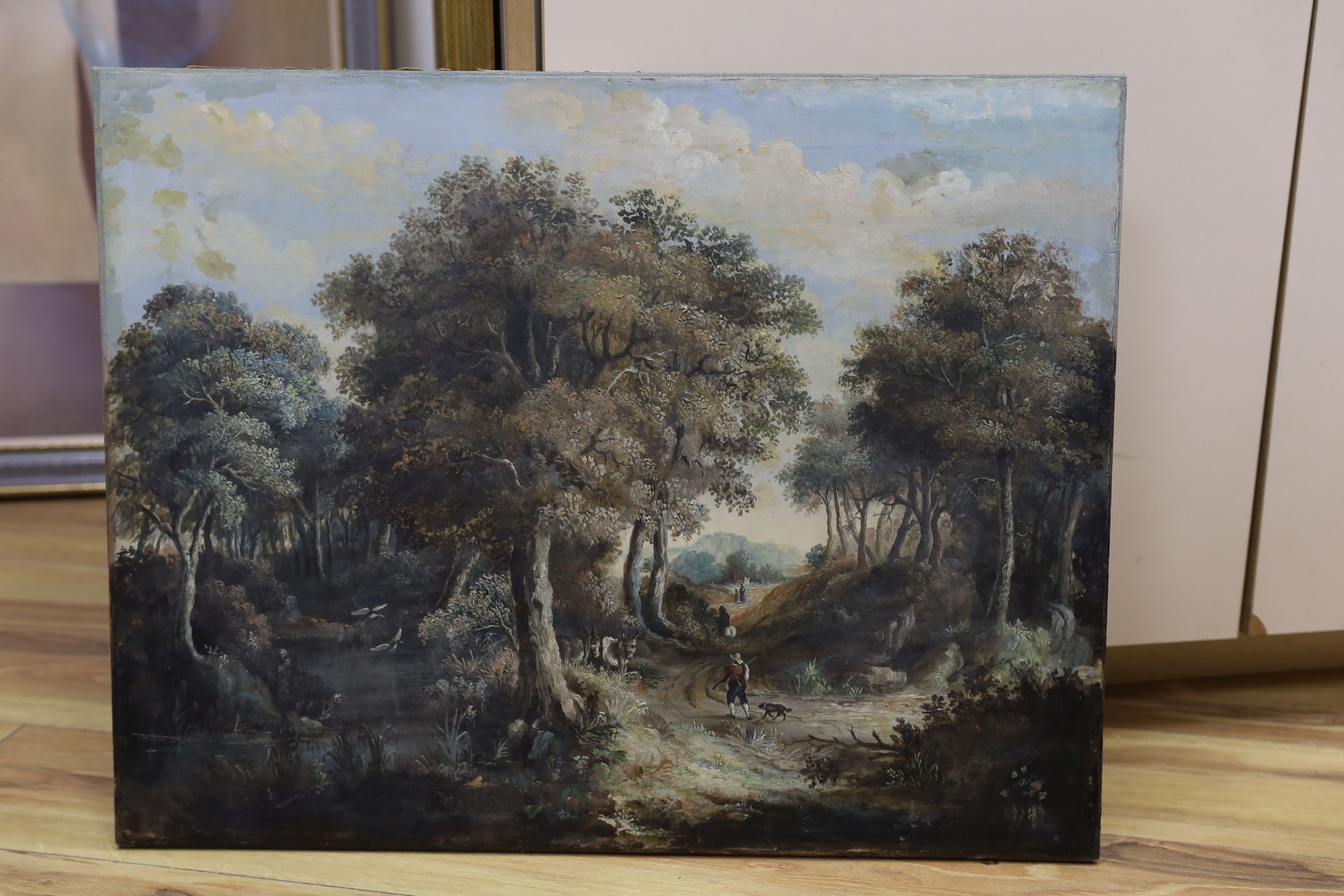 Continental School, oil on canvas, Travellers in a wooded landscape, 47 x 61cm, unframed